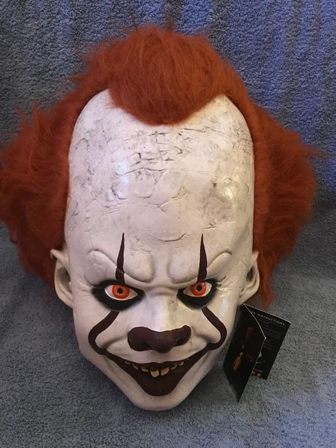 Pennywise from the 2017 Blockbuster remake, It.
Every detail of Pennywise is represented in this mask. This amazing deluxe edition comes with actual
hair attached to the sculpted hair underneath to hold the hair perfectly in place.
So get yourself our IT Pennywise Deluxe Mask and float with your friends this Halloween!
One size fits most.
Collector Quality!
All masks are shipped in a brand new sturdy cardboard box. Sculpted Hair, Clown Mask, Trick Or Treat Studios, Halloween Mask, Halloween Masks, Cardboard Box, Float, Decorative Items, Party Decorations