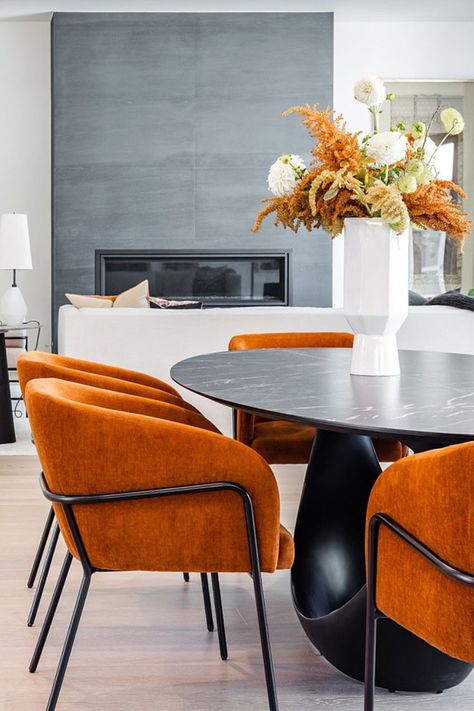 #diningroom #diningtable #tablebase #velvetchair #velvetdiningchair #openplandining #burntorange Orange Velvet Dining Chairs, Burnt Orange Dining Chairs, Burnt Orange Dining Room, 2024 Blessings, Open Plan Dining Room, Burnt Orange Accents, Orange Dining Room, Open Plan Dining, Oval Tables