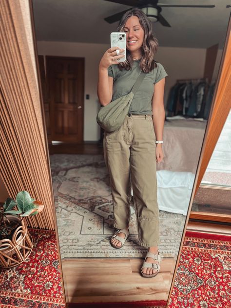 Woman wearing green tee, green crescent bag, and green barrel leg pants taking photo in mirror. Brown hair and smiling Green Blundstone, Green Tee Outfit, Tapered Pants Outfit, Cargo Pants Outfit Fall, All Green Outfit, Outfit Cargo Pants, Birkenstock Boston Outfit, Blundstone Style, Boston Outfits