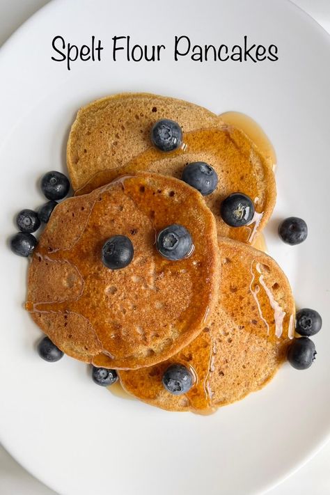 Spelt flour pancakes with blueberries and maple syrup on a white plate. Spelt Pancakes Recipe, Sorghum Flour Pancakes, Spelt Flour Cake Recipes, Spelt Flakes Recipes, Chickpea Flour Cake, Spelt Flour Pancakes, Greek Yoghurt Recipes, Health Treats, Spelt Pancakes