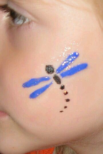 Dragon fly Cheek Painting, Easter Face Paint, Easy Face Painting Designs, Festival Face Paint, Bodysuit Tattoos, Painting Ideas For Kids, Cheek Art, Face Painting Tutorials, Festival Face