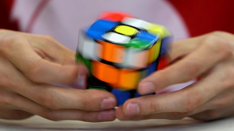 A competitor solves a Rubik's cube during the Rubik's Cube European Championship in Prague Claude Shannon, Yo-yos, Rubik's Cube, Solve Problems, Toys R Us, Information Technology, Online Learning, Master Class, Science And Technology