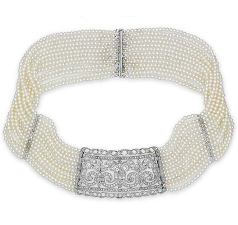 A DIAMOND AND SEED PEARL CHOKER. The central pierced panel millegrain-set with circular rose-cut and old European-cut diamonds in foliate design, to the thirteen-row seed pearl necklace with similarly-cut diamond spacer panels and clasp, mounted in white gold, 33.0 cm long Antique Choker, Journey Pendant, Jeweled Shoes, Pearl Jewels, Pearl Necklace Designs, Pearl And Diamond Necklace, Vintage Fine Jewelry, Necklace Choker, Seed Pearl