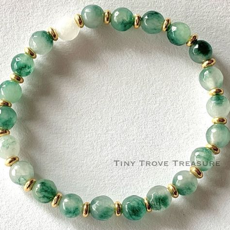 Green Chalcedony Elegance- Handcrafted Green Chalcedony Bracelet -Easter-Unisex-Adult bracelets-Elastic bracelet Feel the tranquillity with our handmade bracelet featuring stunning green chalcedony beads. Perfect for any occasion, this accessory adds a touch of natural beauty to your style. - Green Chalcedony Beaded Bracelet - Crafted with 6mm/8mm natural stone beads - Elastic design for comfort and style - Radiates natural beauty and tranquility - Fosters a sense of unity and belonging wit... Chalcedony Bracelet, Green Chalcedony, Natural Stone Beads, Elastic Bracelet, Bracelet Crafts, Beaded Rings, Handmade Bracelet, Handmade Bracelets, Stone Beads