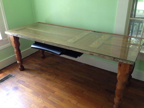 This is my computer desk. It is made from a recycled old door stripped of old paint, recycled railings, computer keyboard tray added, and safety glass to make the desktop level. Desk Made Out Of Old Doors, Side Table From Old Door, Old Door Desk, Coffee Table Made From Old Door, Desk Made From Old Piano, Window Desk, Door Desk, Closet Office, Keyboard Tray