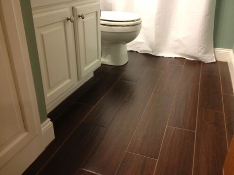 Like the wood looking tile, especially for the laundry room Bathroom Dark Brown Floor, Bathrooms With Dark Wood Floors, Dark Wood Floor Bathroom Ideas, Dark Wood Floor Bathroom, Dark Wood Bathroom Floor, Dark Engineered Wood Floors, Dark Vanity Bathroom, Dark Brown Floor, Dark Wooden Floor