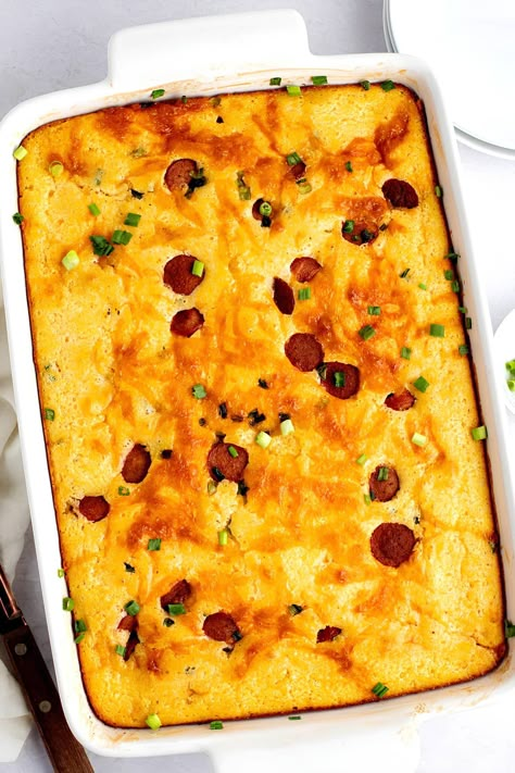 This corn dog casserole recipe is always a hit! Made with hot dogs, cornbread, and veggies, it's a fun dish everyone will love. Chili Dog Cornbread Casserole, Kielbasa And Cornbread, Little Smokies Baked Beans And Cornbread, Cornbread And Hotdogs, Lil Smokies Casserole, Beans And Weenies Recipes, Hot Dog Casserole Recipes, Corn Dog Casserole, Crockpot Cornbread