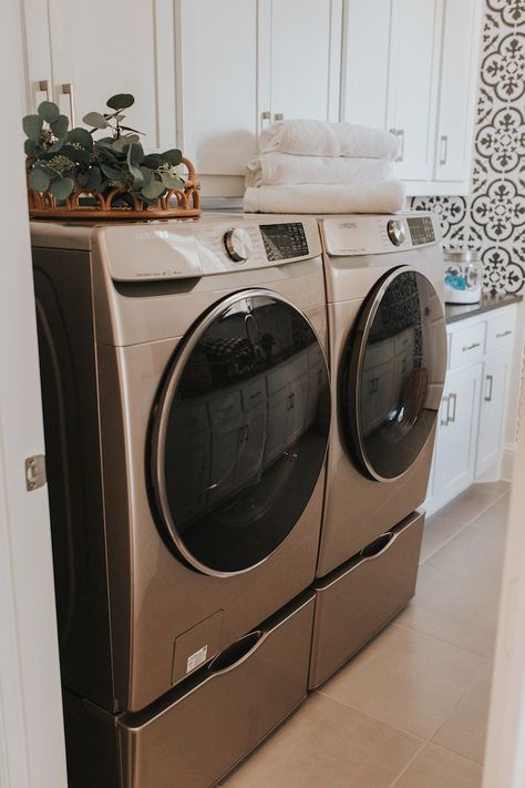 Laundry Room With Champagne Washer, Champagne Washer Dryer Laundry Room, Rose Gold Washer And Dryer Laundry Room, Satin Nickel Washer And Dryer Laundry Room, Grey Washer Dryer Laundry Room, Small Laundry Room Ideas With Front Loaders On Pedestals, Front Loader With Pedestal Laundry Room Ideas, Laundry Room Design Front Loaders On Pedestals, Gray Washer And Dryer Laundry Room