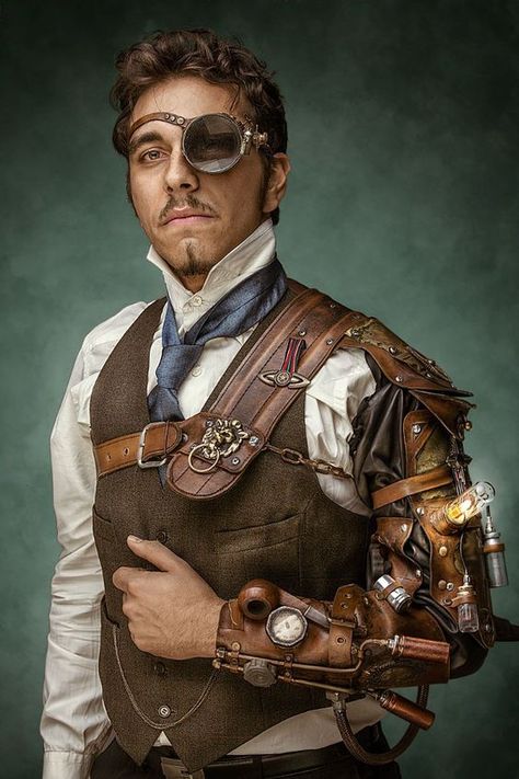 Monocled Steampunk Man - Large glass monocle, high collared shirt, tie, waistcoat (vest), pocket watch, trousers, steam-powered bracer/mechanical arm. Men's Steampunk fashion inspiration! - For costume tutorials, clothing guide, fashion inspiration photo gallery, calendar of Steampunk events, & more, visit SteampunkFashionGuide.com Steampunk Male, Steampunk Mode, Moda Steampunk, Steampunk Man, Steampunk Gadgets, Steampunk Men, Mode Steampunk, Steampunk Couture, Steampunk Tendencies