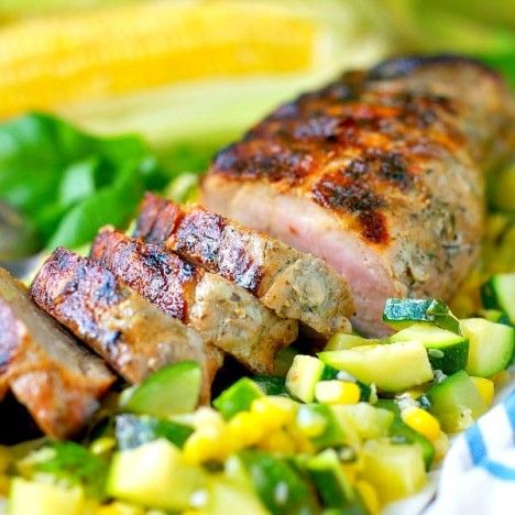 A fresh, healthy, and low calorie dinner is just 30 minutes away! This easy Grilled Garlic and Herb Pork Tenderloin with Zucchini and Corn is a fast weeknight meal that the whole family will love! Garlic And Herb Pork Tenderloin, Herb Pork Tenderloin, Low Calorie Dinner, Grilled Garlic, Low Calorie Dinners, Tenderloin Recipes, Low Carb Zucchini, Pork Tenderloin Recipes, Stuffed Pork Tenderloin