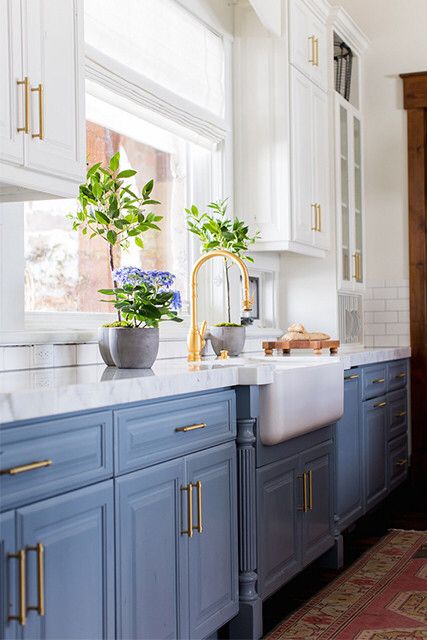 Let them bake cake! In this kitchen the soft, blue cabinets and warm metallic fixtures would make Marie Antoinette proud. Bright white upper cabinets accent the blue, keeping it current and classic all at the same time. Kitchen With Blue Cabinets, Green Kitchens, Blue Kitchen Designs, Cabinet Inspiration, Kitchen Ikea, Blue Kitchen Cabinets, Farmhouse Kitchens, House Updates, Farmhouse Kitchen Cabinets