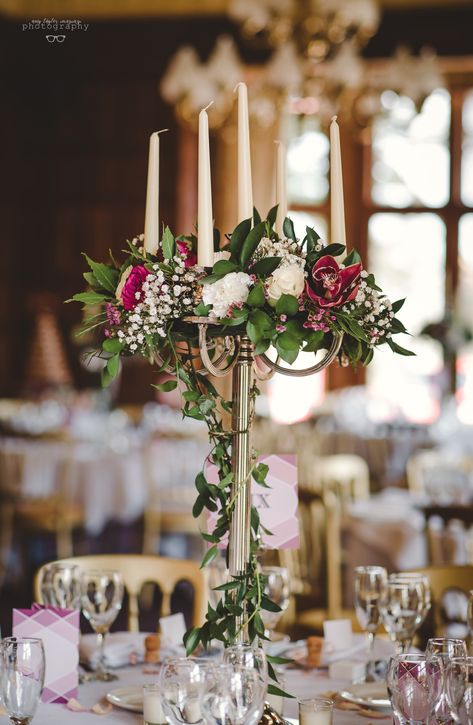 A stunning floral candelabra centrepiece Flower Candelabra Centerpiece, Candelabra Wedding Centerpieces Flowers, Candelabra Floral Arrangements, Candelabra Table Setting, Wedding Candelabra Centerpiece, Candleabras Centerpiece, Diy Candelabra Centerpiece, Candelabra With Flowers, Cheap Wedding Table Centerpieces