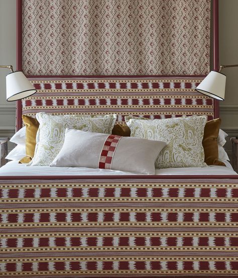 Upholstered bed frame in red and gold Ikat stripes. Cushions are centred on the bed. Bedside lamp on either side of bed. Ikat Headboard, Ikat Stripe, Ikat Curtains, Fabric Combinations, Curtains Blinds, Simple Colors, Giraffes, Fun Design, Headboards