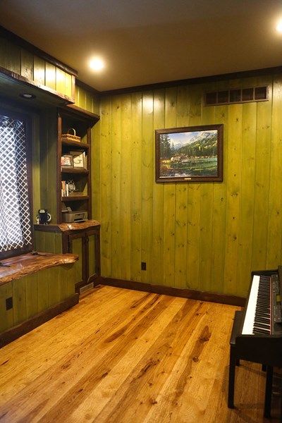 How to Make Wood Paneling Look More Modern | Northern Log Staining Wood Paneling Walls, Cover Up Wood Paneling, Paneling With Wallpaper, Old Wood Paneling, Knotty Pine Paneling, Knotty Pine Walls, Lumber Mill, Tongue And Groove Panelling, Cabin Rustic