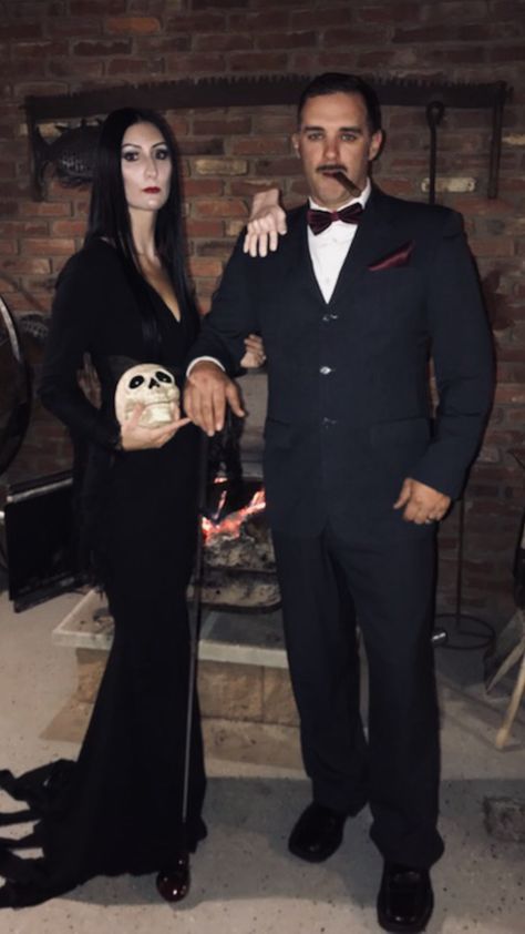 DIY Addams Family Halloween costume. Morticia and Gomez Addams Halloween Costume Morticia And Gomez, Couples Costumes Morticia And Gomez, Morticia Addams Couple Costume, Diy Morticia And Gomez Costume, Adams Family Morticia Costumes, Adams’s Family Costume, Adams Family Halloween Party Ideas, Addams Family Couple Costume, Morticia Adams Halloween Costumes