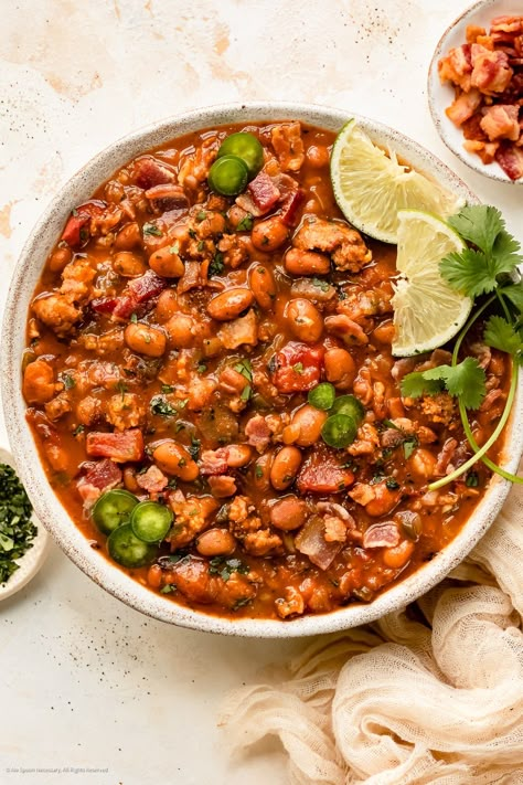 Overhead photo of cooked beans in Mexican style with chorizo and cilantro. Easy Charro Beans, Charro Beans Recipe, Meat Soups, Mexican Beans Recipe, Cowboy Recipes, Beans Mexican, Mexican Pinto Beans, Mexican Beans, Charro Beans