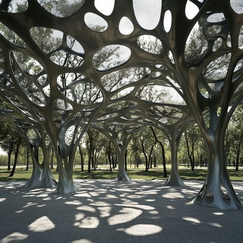 Discover this nature-inspired aluminum canopy, perfect for material building projects in outdoor spaces. With its tree-like design and leaf-shaped cutouts, this aluminum structure allows sunlight to create beautiful shadows below. Lightweight and corrosion-resistant, it blends functionality with a natural aesthetic, making it ideal for sustainable architecture in parks and open areas. Samet Nangshe, Forest Architecture, Building Materials Architecture, Fountain Plaza, Biomimicry Architecture, Building And Construction, Natural Aesthetic, Building Projects, Construction Industry