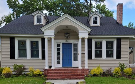 SW 6516 Down Pour bright blue front door, spray painted black shutters, tan siding Down Pour Sherwin Williams, Tan House Black Shutters, Sherwin Williams Front Door, Tan Siding, Navy Shutters, Purple Paint Color, Front Door Black, Purple Paint Colors, Tan House