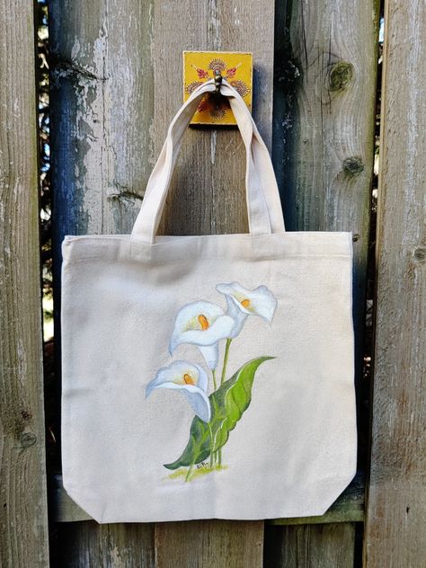 Language Of The Flowers, Jute Bags Design, Diy Tote Bag Design, Painted Canvas Bags, White Calla Lilies, Handpainted Tote Bags, Bird Paintings On Canvas, Totes Ideas, Flower Painting On Canvas