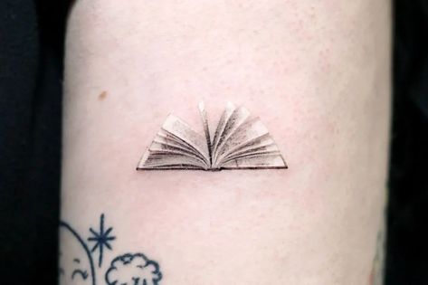 Book Hand Tattoo, Tiny Book Tattoo Minimalist, Book Ankle Tattoo, Book Wrist Tattoo, Book Tattoo Fine Line, Book Tatoos Woman, Places For Small Tattoos On Women, Small Book Tattoos For Women, Small Bookish Tattoos