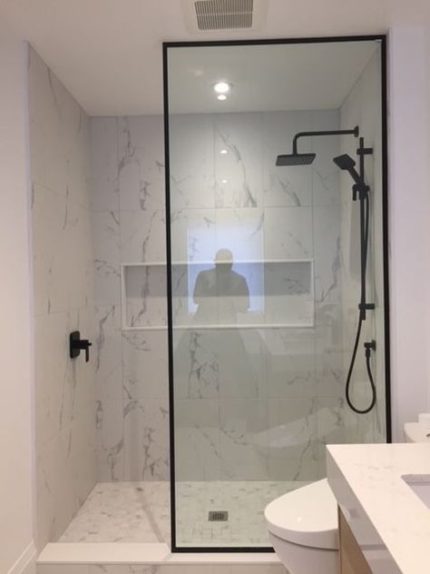 Single Shower Panel, Contemporary Shower Design, Condo Shower Ideas, Shower Glass With Black Frame, Black Shower Doors Frame, Black Framed Shower Glass Panel, Single Glass Panel Shower Door, Glass Shower With Black Frame, Bathrooms With Matte Black Hardware