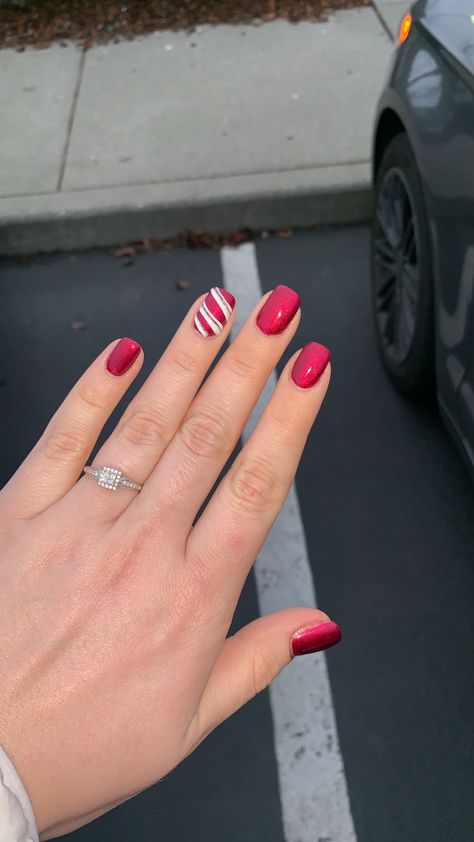 Red Nails With Candy Cane Ring Finger, Plain Xmas Nails, Red Nails With Candy Cane Accent, Red And Green Candy Cane Nails, Candy Cane Tip Nails, Christmas Nails Candy Cane Stripes, Red Nails With Candy Cane, Candy Cane Accent Nail, Candy Cane Acrylic Nails