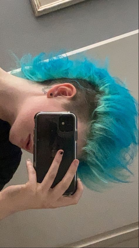 Light blue Mohawk with brown shaved sides Blue Hair Mohawk, Mowhak Hairstyle Pixie, Blue Mullet Aesthetic, Mullet Blue Hair, Split Dye Mohawk, Punk Mohawk Mullet, Fluffy Mohawk Punk, Punk Blue Hair, Mohawk Reference