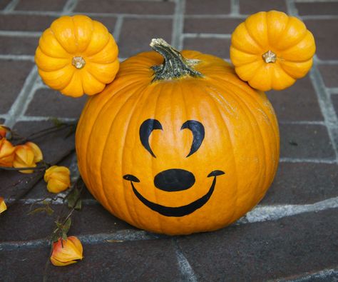 I absolutely love Halloween time at Disneyland. By making this Mickey pumpkin, you can bring Disney Halloween magic to your own home. While at Disneyland earlier this October, I visited the Halloween Carnival at Big Thunder Ranch where I came across a Mickey pumpkin that inspired this design. When it came to making decorations for Halloween, I decided that this would be the perfect touch for our front porch. I especially like that this design requires no carving, which allows this pumpkin to... Porche Halloween, Halloween Time At Disneyland, Pumpkin Mickey, Disney Halloween Decorations, Mouse Pumpkin, Halloween School Treats, Halloween Decor Diy, Mickey Mouse Pumpkin, Disney Pumpkin