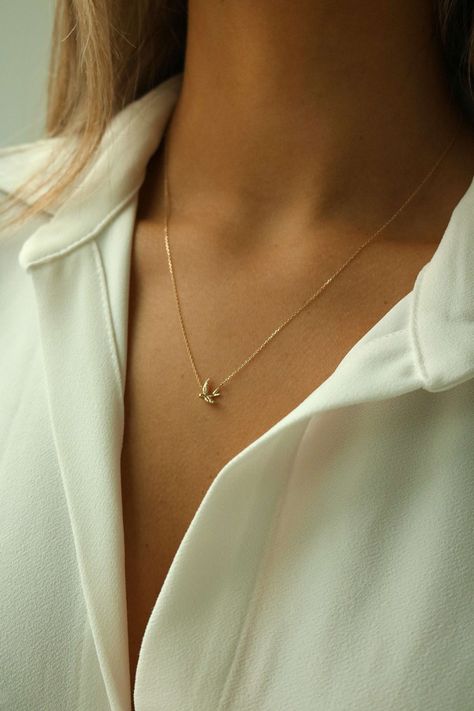 Sparrow Bird Necklace in solid 14k gold is an everyday staple pendant you'll absolutely adore. Stunning solid 14k gold bird pendant that can be worn everyday. A classic staple that will bring you so much joy.  This 14k gold Sparrow Bird Necklace is absolutely adorable. - forever piece - modern - dainty Details: - 14k solid gold pendant and chain - Measurements: 16in with 2in extender (adjustable 16-18in) - Hypoallergenic - Ships from a small business - Style: Minimalist, dainty, modern - Will no Sparrow Necklace, Tiny Gold Necklace, Swallow Necklace, Sparrow Bird, Animal Necklace, Minimal Necklace, Braided Ring, Bird Charm, Bird Necklace