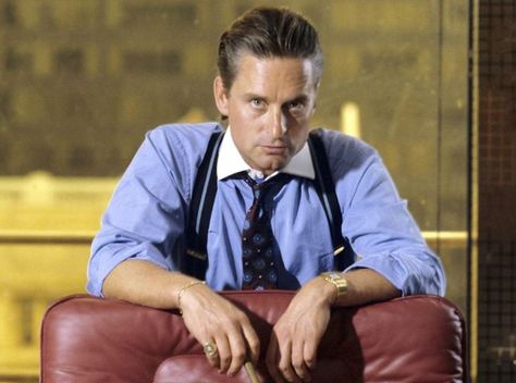 Michael Douglas as Gordon Gekko in Wall Street, 1987. Probably wearing a Cartier Santos plus a signet ring and gold bracelet. Wall Street 1987, Gordon Gekko, Contrast Collar Shirt, Fun Trivia Questions, Robert Englund, Hugo Weaving, Norman Bates, Michael Douglas, Anthony Perkins