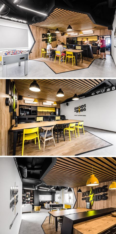 In the employee break room of this modern office, the area is split up into two sections, the first being the kitchen and dining area. Diagonal lines that outline the wood have been used to clearly define the area, while the wood slats and wood wall create a contrast to the black and yellow kitchen. Industri Modern, Bar Exterior, Industrial Office Design, Lamps Bedroom, Kitchen Black, Tiles Bathroom, Wall Bathroom, Yellow Kitchen, Nordic Interior