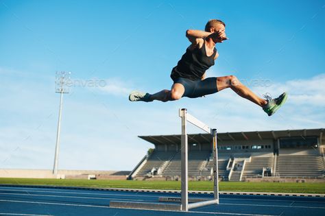 Professional sprinter jumping over a hurdle by jacoblund. Professional male track and field athlete during obstacle race. Young athlete jumping over a hurdle during training o...#hurdle, #jacoblund, #male, #Professional Hurdles Track, Obstacle Race, Track And Field Athlete, Photos Booth, Figure Reference, Harvard Business Review, Usain Bolt, Olympic Athletes, Gym Routine