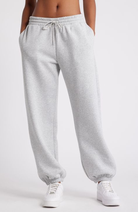 Get into cozy mode with these oversized sweatpants made with soft fleece and the essential elastic waist. Elastic/drawstring waist 68% cotton, 32% recycled polyester Machine wash, tumble dry Imported Not available for sale and shipment to Germany Best Place To Buy Sweatpants, Grey Sweatsuit Outfits Women, Rolled Sweatpants, Aritzia Sweatpants Outfit, Oversized Sweatpants Outfit, Women Sweatpants Outfits, Grey Sweats Outfit, Sweatpants Outfit Fall, Cozy School Outfits