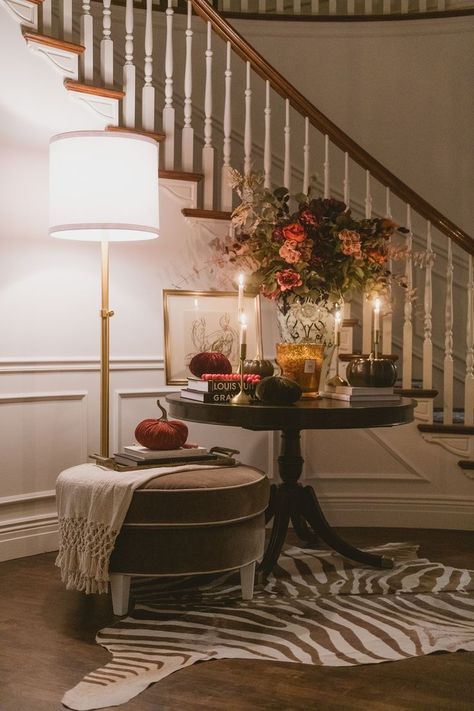 A palette of soft pinks, greys and charcoals dresses Westover’s welcoming foyer. A zebra patterned throw rug adds an extra layer of texture to the display, while an autumnal flower arrangement anchors the room Design and photo by Rebekah Westover Cozy Layered Living Room, Alice Lane Entryway, Entryway Traditional Decor, Alice Lane Living Room, Soulful Living Room, Contemporary Fall Decor, Contemporary Living Room Inspiration, Alice Lane Interiors, Contemporary Entryway Ideas