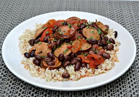 Mexican Black Beans and Rice with smoked sausage is a slightly spicy dish that's perfect for busy weeknights. This quick and satisfying beans and rice recipe is a dish you'll want to put on your dinner menu once a month. Sausage And Black Beans, Easy Beans And Rice, Black Beans And Sausage, Mexican Black Beans And Rice, Rice With Smoked Sausage, Easy Beans, Rice With Sausage, Mexican Black Beans, Black Beans And Rice