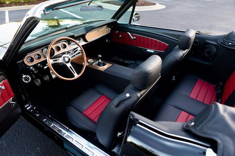 This is a 1966 Mustang GT Convertible in Raven Black. It has Red and Black Nappa Leather Two-Tone interior. This car has 17x8 Styled Aluminum Charcoal wheels. It features a 460hp Ford 5.0L Ti-VCT Coyote DOHC V8 engine and a Tremec T-56XL 6-speed manual transmission. #mustang #shelby #classicmustang #classicshelby #carinspiration #black #blackcar #classiccar Black Mustang Red Interior, 1966 Mustang Gt, Green Mustang, Mustang 1968, Mustang Gt Convertible, Mustang Interior, Black Mustang, 1966 Mustang, Oc Board