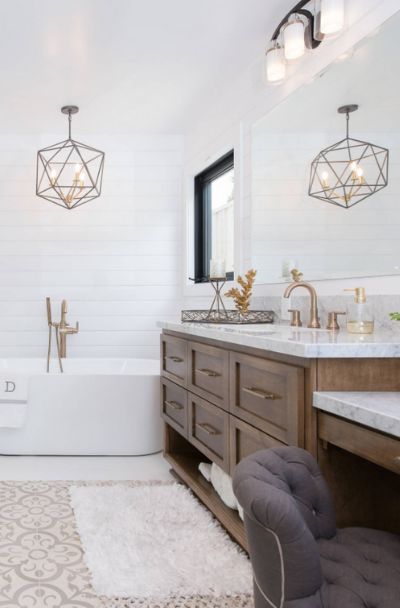 29 Farmhouse Chandelier Light Fixtures Ideas - | Sebring Design Build Bathroom Chandelier Over Tub Farmhouse, Master Bath Lighting Fixtures, Light Above Bathtub, Bathroom Chandelier Over Tub, Light Over Tub, Bathroom Chandelier Lighting, Modern Farmhouse Bathroom Lighting, Bathtub Lighting, Farmhouse Fireplace Mantels