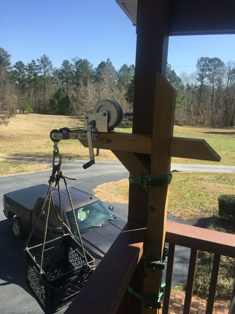 A handicapped grocery hoist. We live on the second floor apartment. So to bring groceries and supplies up I built this device. I used a mailbox post and boat winch with a keel roller. I straps to attach to a 4x8 post to secure it. It will lift around 200lbs. Pulley System For Groceries, Treehouse Elevator, Themes For Christmas, Christmas Home Decorating, Second Floor Deck, Tree House Plans, Floor Apartment, Cubby House, Mailbox Post