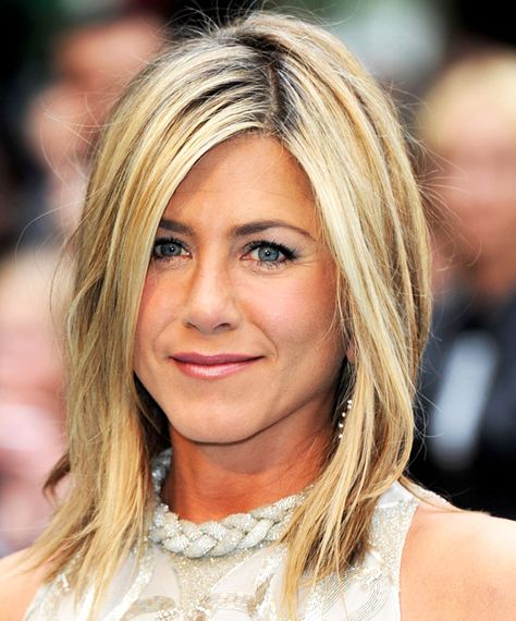 Jennifer Aniston, 45-If you're still asking for "The Rachel" at the salon, take a cue from Jennifer Aniston here and upgrade to a style with considerably fewer layers. Her flirty A-line bob has movement and volume, while the side part frames her face -- a top tip from Petroff. Just like bangs, a side part is an instant anti-ager. 45 Year Old Women, Champagne Blond, Elegance Hair, Hair Evolution, Jennifer Aniston Hair, Jenifer Aniston, Fresh Hair, Hair Color Highlights, Rachel Green