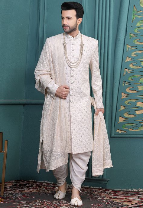 Art Silk Sherwani in Off White This attire is Enhanced with Buttons, Resham and Sequins Work, Crafted in Chinese Collar Neck and Full Sleeve Available with a Faux Georgette Dhoti Pant in Off White and a Faux Georgette Dupatta in Off White Do note: Kanthimala and Footwear shown in the image is for presentation purposes only. Half to one inch may vary in measurement. (Slight variation in actual color vs. image is possible) Marriage Dress For Men, Engagement Dress For Groom, Wedding Matching Outfits, Indian Groom Dress, Indian Wedding Clothes For Men, Groom Sherwani, Sherwani For Men Wedding, Wedding Kurta For Men, Groom Dress Men