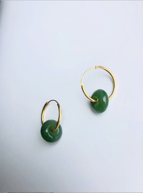 A stunning pair of modern-look dark green jade donut drop earrings.Simple and elegant. Hand-made from the premium 100% natural and real green nephrite green jades circle and 925 sterling silver plated with 18K gold in a minimalistic style. The stylish gold and green minimalistic design is great for your day-to-day classic wear or special occasions. Perfect as a gift for yourself or your loved ones. Some highlights of this pair of eye-catching genuine dark green jade drop earrings are: *High-qual Green Jade Jewelry, Jade Hoop Earrings, Jade Jewelry Design, Donut Earrings, Jade Jewellery, Earrings Outfit, Real Green, Classic Wear, Circle Jewelry