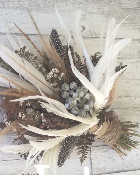 Boho feather bouquet Feathers In Floral Arrangements, Boho Style Flower Arrangement, Quail Feather Bouquet, Native American Floral Arrangements, Flower Bouquet With Feathers, Duck Feather Bouquet, Antler Wedding Bouquet, Turkey Feather Wedding Bouquet, Viking Wedding Bouquet