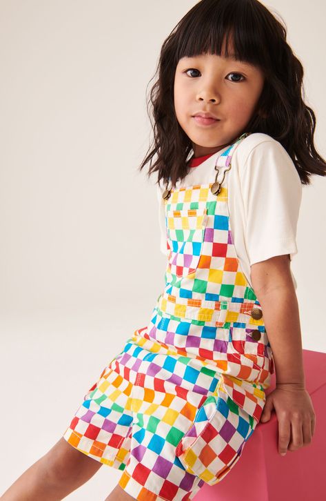 Rainbow hues checker these all-cotton short overalls fitted with roomy pockets and served with a perfectly matched ringer T-shirt. Adjustable buckle straps; side button closures Bib pocket; scoop pockets; cargo flap-patch pockets; back flap pockets 100% cotton Machine wash, tumble dry Imported Rainbow Checkerboard, Jools Oliver, Kidswear Trends, Bright Outfit, Cotton Dungaree, Short Overalls, Quirky Fashion, White Rainbow, Fun Fashion