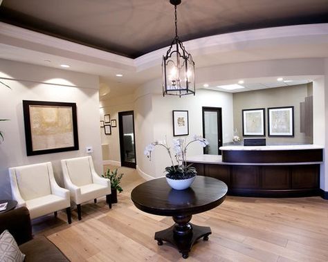 dark wood furniture with light wood floors | Light floor, dark wood furniture Plastic Surgeon Office, Grey Floors, Waiting Room Design, Office Reception Area, Medical Office Decor, Office Waiting Rooms, Lighting Feature, Medical Office Design, Dental Office Decor