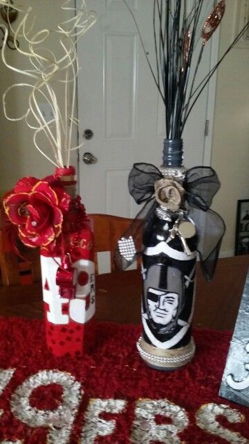 My football bottles ... Nfl Crafts Diy, Football Vase Diy, Football Mason Jars, Nfl Ornaments Diy, Football Centerpiece Vase, Oakland Raiders Logo, Raiders Fans, Lighted Wine Bottles, Oakland Raiders