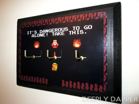 “It’s Dangerous To Go Alone!” Keyrack | Community Post: 19 Must-Have Items For Zelda Fanatics Nerd Furniture, Geek Furniture, Nerd House, Zelda Party, Zelda Gifts, Gamer Decor, Geek Diy, Zelda Birthday, Nerd Crafts