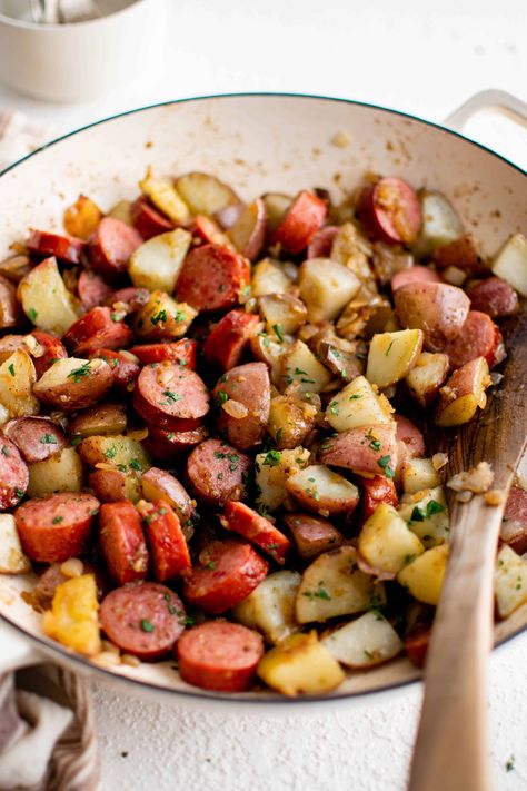 This quick and easy Kielbasa and Potatoes Recipe is the perfect one-dish weeknight dinner. Made with simple ingredients including red potatoes, onion, garlic, and flavorful kielbasa sausage, the whole family will love this flavorful combination. Kielbasa Peppers And Potatoes, Kielbasa With Potatoes, Smoked Sausage And Red Potatoes, Kielbasa And Potatoes Stovetop, Recipes With Beef Kielbasa, Fried Kielbasa, Turkey Kielbasa Recipes, Easy Kielbasa Recipes, Kilbasa Sausage Recipes