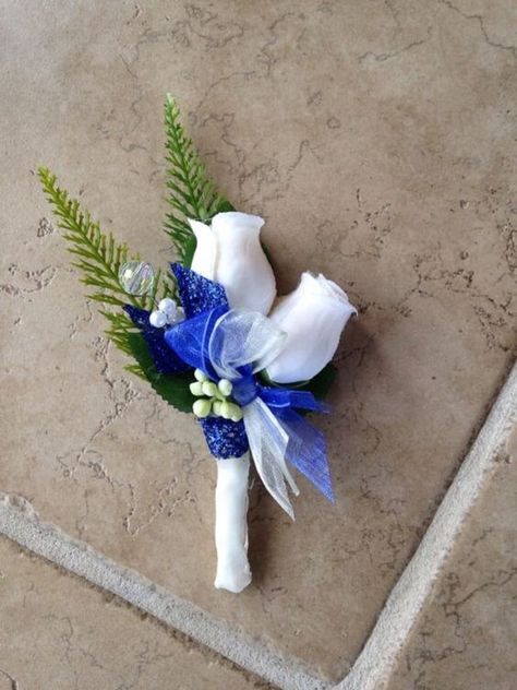 Bright Royal Blue and Metallic Silver Winter Wedding Color Ideas - ColorsBridesmaid Blue Boutonnieres, Bridesmaid Dresses Silver, Grey Groom Suit, Royal Blue Wedding Decorations, Wedding Flowers Blue, Silver Winter Wedding, Blue Bouquets, Winter Wedding Color Ideas, Blue Boutonniere