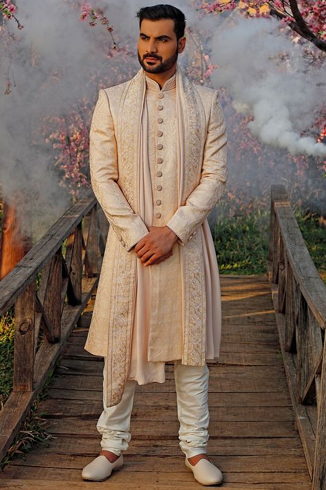 Featuring a peach sherwani in silk base with pearls embroidery. It is paired with matching churidaar pants.  FIT: True to size. COMPOSITION: Silk. CARE: Dry clean only. Peach Sherwani, Indo Western Outfits For Men, Formal Dress For Men, Pearls Embroidery, Wedding Outfits Indian, Embroidered Sherwani, Modern Groom, Indian Wedding Outfit, Sherwani For Men