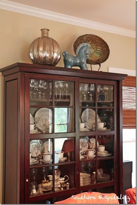 top of China cabinet decor Decorate Top Of Curio Cabinet, China Cabinet Top Decor, Decorating Top Of China Cabinet, Dining Room China Cabinet Ideas, Decorate Top Of China Cabinet, Top Of China Cabinet Decor, Hutch In Living Room, Top Of Cabinet Decor, Living Room Bar Cabinet